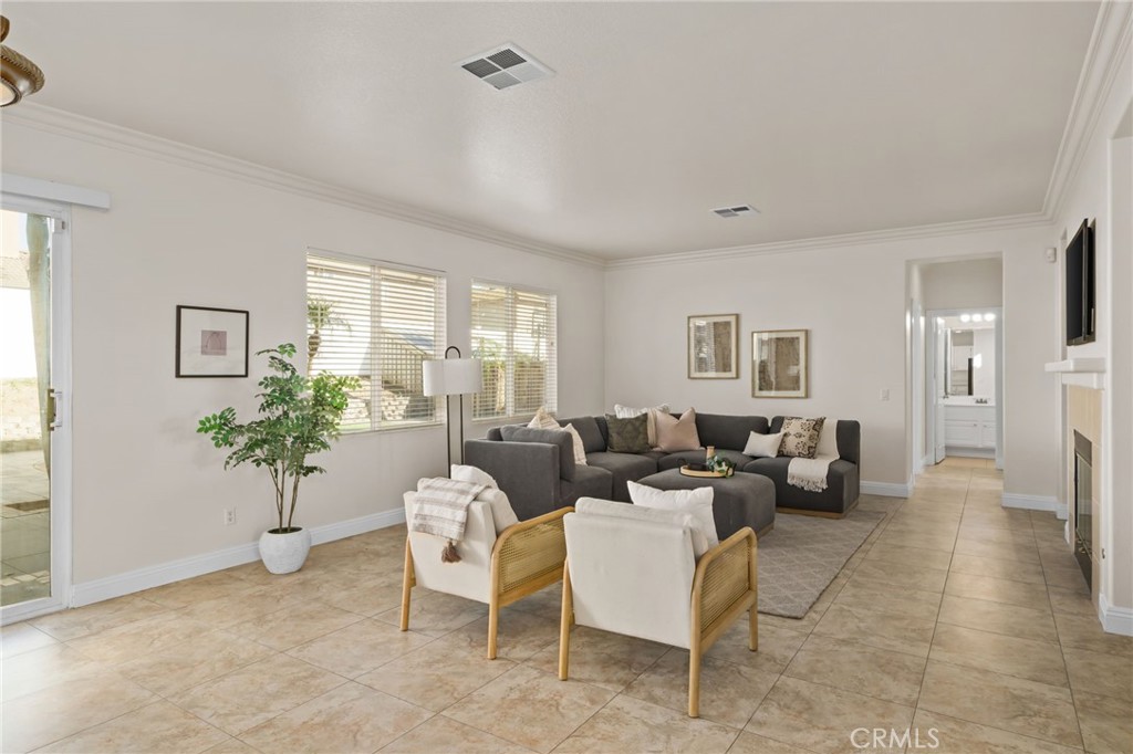 6124 Risingstar Drive Eastvale, CA 92880 - Photo 13 of 37 a living room with furniture and a potted plant