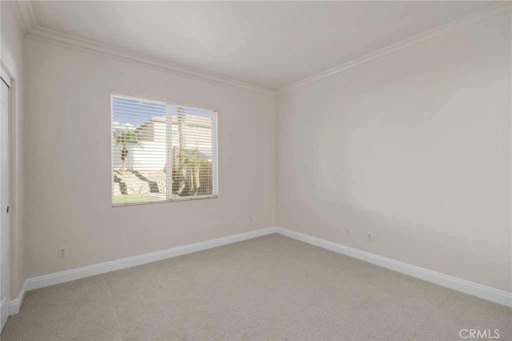 6124 Risingstar Drive Eastvale, CA 92880 - Photo 17 of 37 an empty room with a window