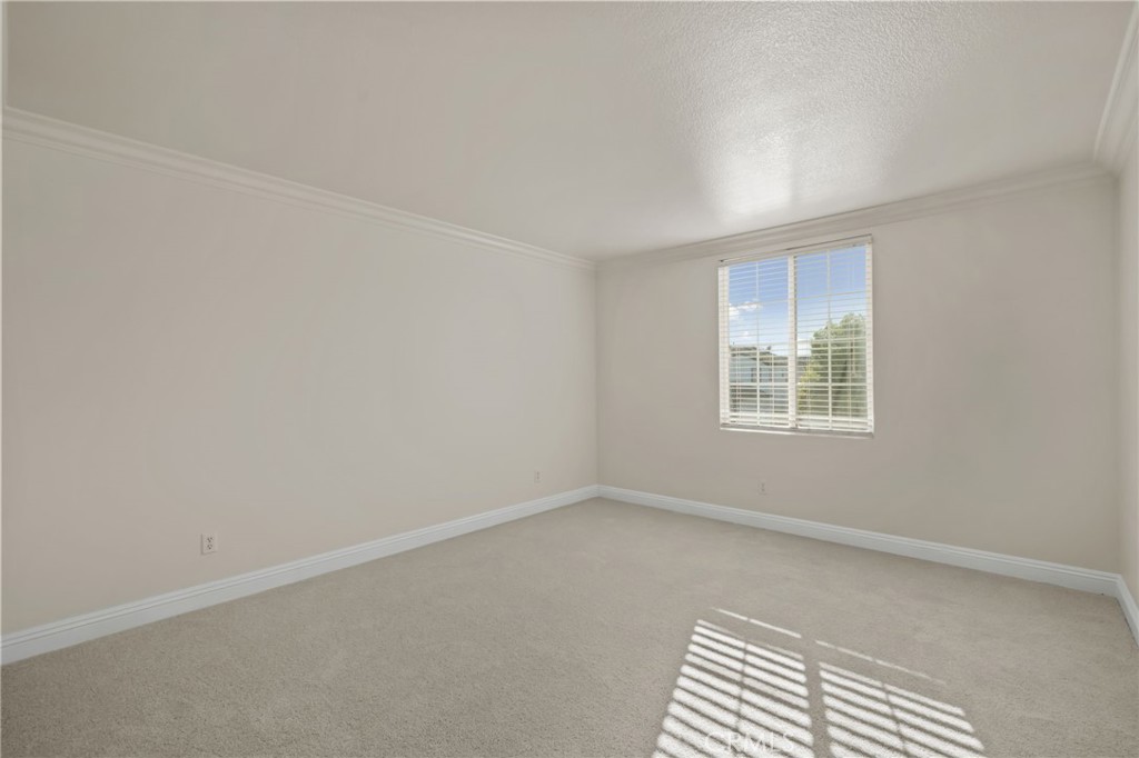 6124 Risingstar Drive Eastvale, CA 92880 - Photo 22 of 37 an empty room with windows