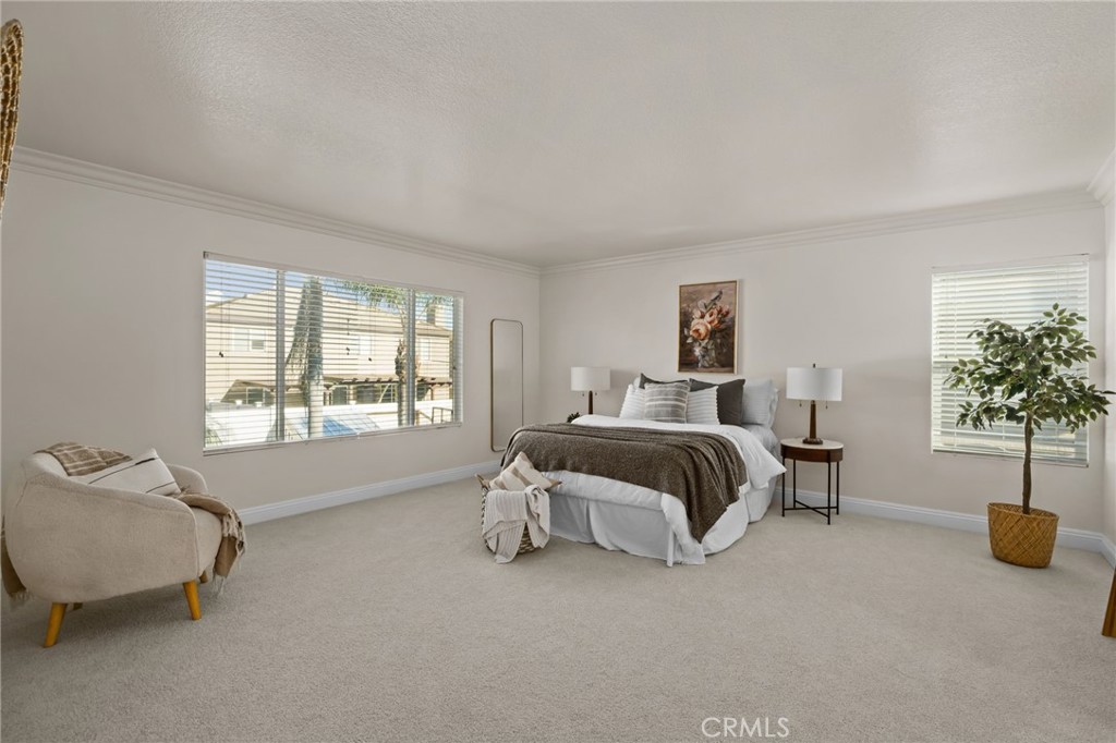 6124 Risingstar Drive Eastvale, CA 92880 - Photo 24 of 37 a bedroom with a bed and window