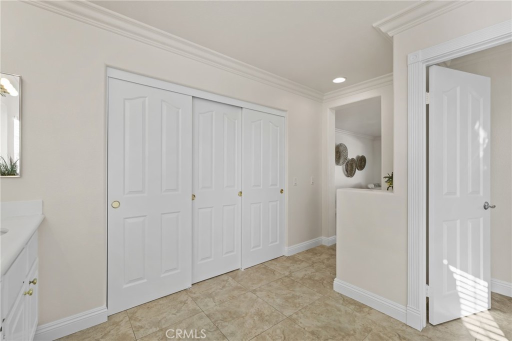 6124 Risingstar Drive Eastvale, CA 92880 - Photo 28 of 37 a view of a bathroom with closet area