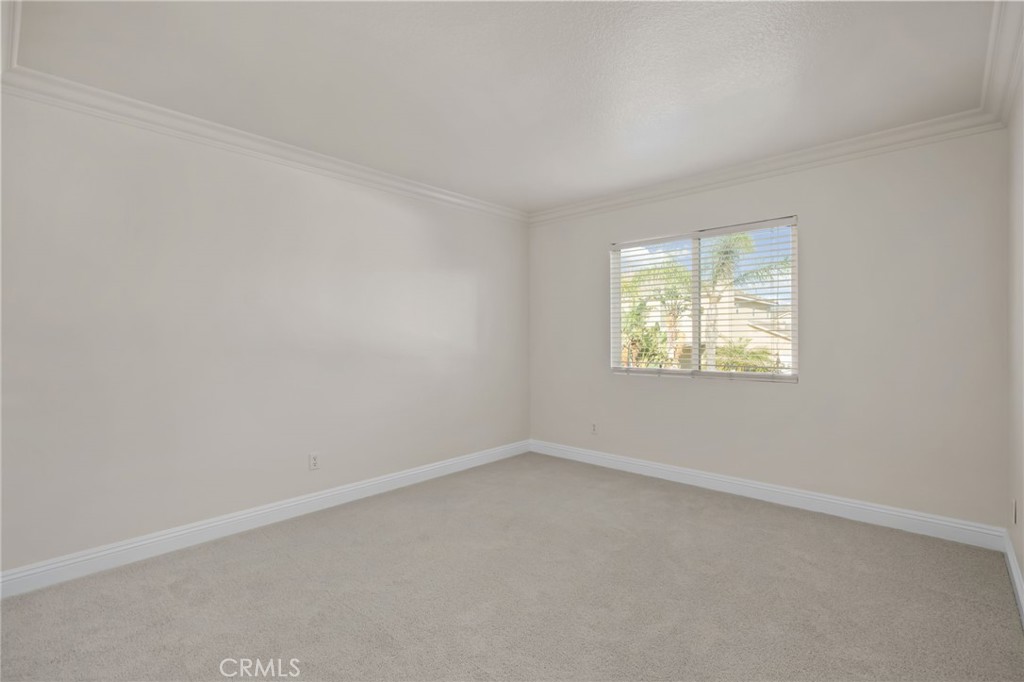6124 Risingstar Drive Eastvale, CA 92880 - Photo 31 of 37 an empty room with a window