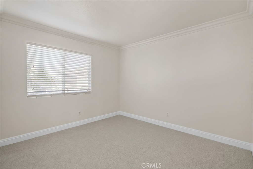 6124 Risingstar Drive Eastvale, CA 92880 - Photo 33 of 37 an empty room with a window