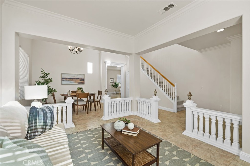 6124 Risingstar Drive Eastvale, CA 92880 - Photo 7 of 37 a living room with furniture and a dining table
