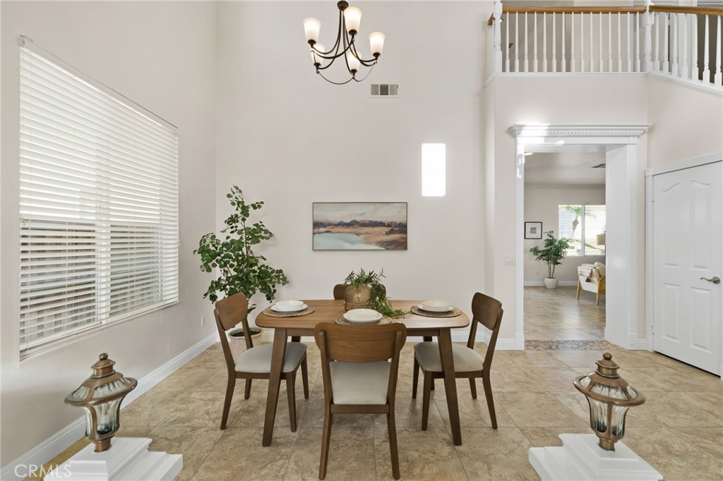 6124 Risingstar Drive Eastvale, CA 92880 - Photo 8 of 37 a dining room with furniture and window