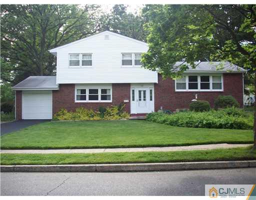 18 Hamlin Road East Brunswick, NJ 08816 - Photo 1 of 10 a front view of a house with a garden
