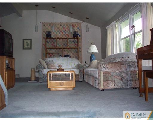 18 Hamlin Road East Brunswick, NJ 08816 - Photo 5 of 10 a bedroom with bed and a large window