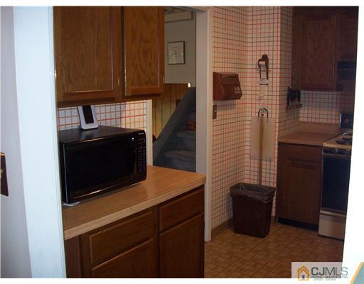 18 Hamlin Road East Brunswick, NJ 08816 - Photo 10 of 10 a kitchen with a sink and cabinets