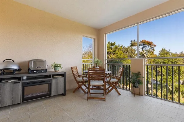 a kitchen with granite countertop wooden cabinets and stainless steel appliances