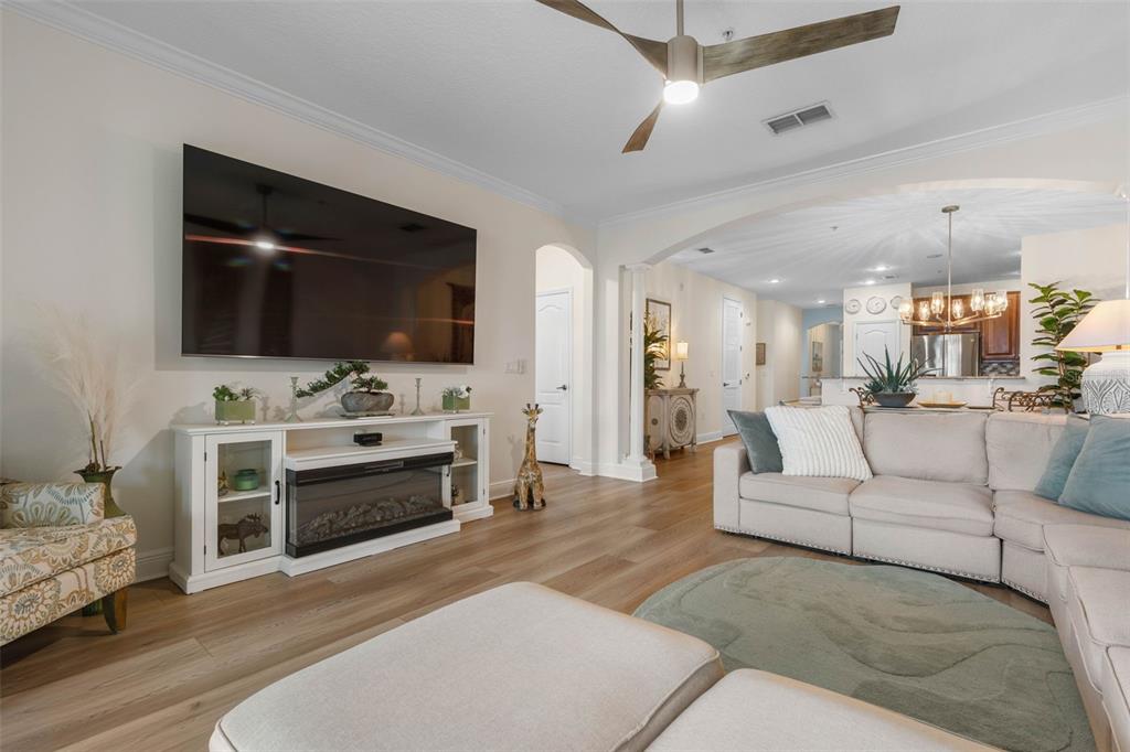 55 Riverview Bend South, Unit 2033 Palm Coast, FL 32137 - Photo 17 of 75 a living room with furniture and a flat screen tv