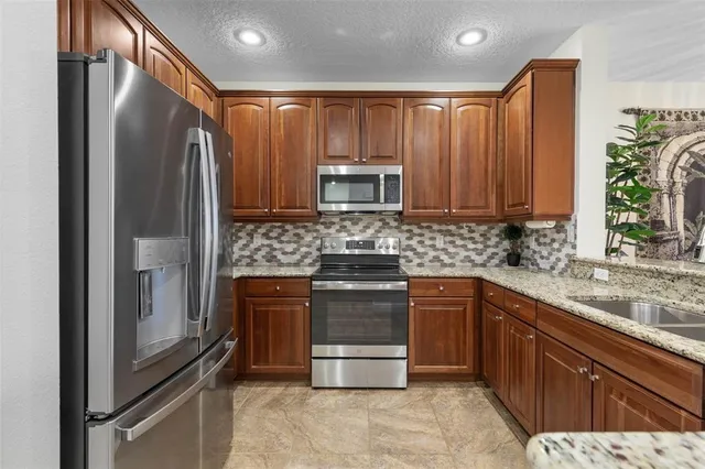 a bathroom with double vanity sink and a mirror