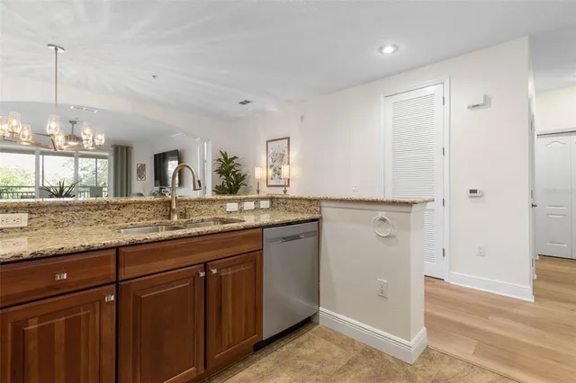 a bedroom with a bed and a lamp