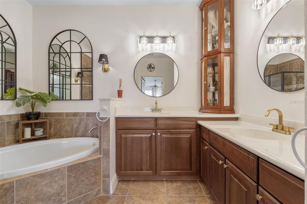 55 Riverview Bend South, Unit 2033 Palm Coast, FL 32137 - Photo 28 of 75 a bathroom with a double vanity sink and a bathtub