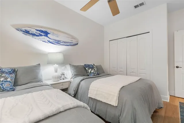 an aerial view of a house with a yard and lake view