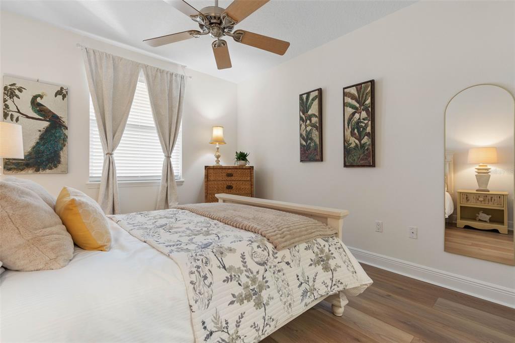 55 Riverview Bend South, Unit 2033 Palm Coast, FL 32137 - Photo 36 of 75 a bedroom with a bed and wooden floor