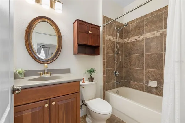 an aerial view of a house with garden space and street view