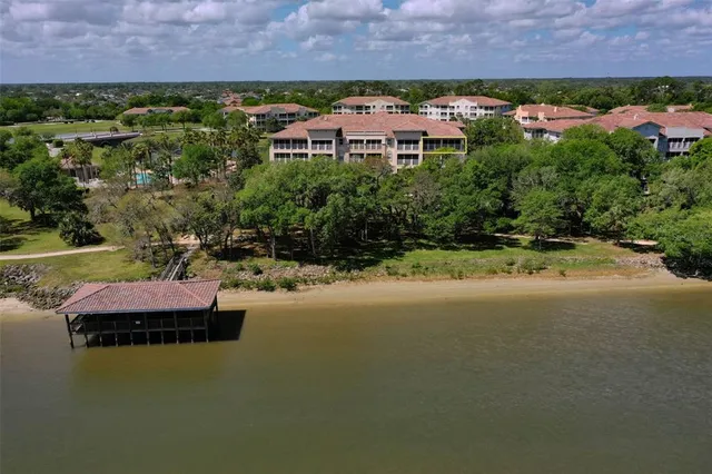 a room with pool table and a chandelier
