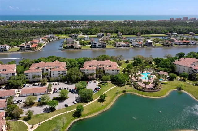 a view of a dining room with furniture and a chandelier
