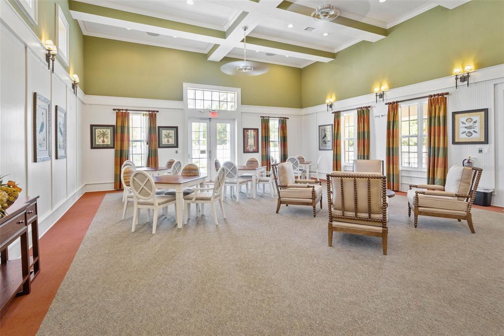 55 Riverview Bend South, Unit 2033 Palm Coast, FL 32137 - Photo 62 of 75 a living room with furniture and a floor to ceiling window