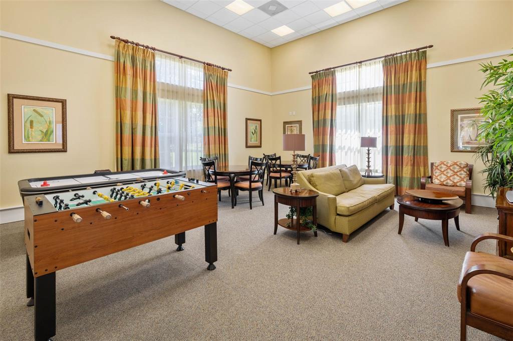 55 Riverview Bend South, Unit 2033 Palm Coast, FL 32137 - Photo 68 of 75 a living room with furniture and a large window