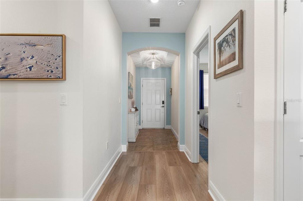 55 Riverview Bend South, Unit 2033 Palm Coast, FL 32137 - Photo 7 of 75 a view of a hallway with wooden floor