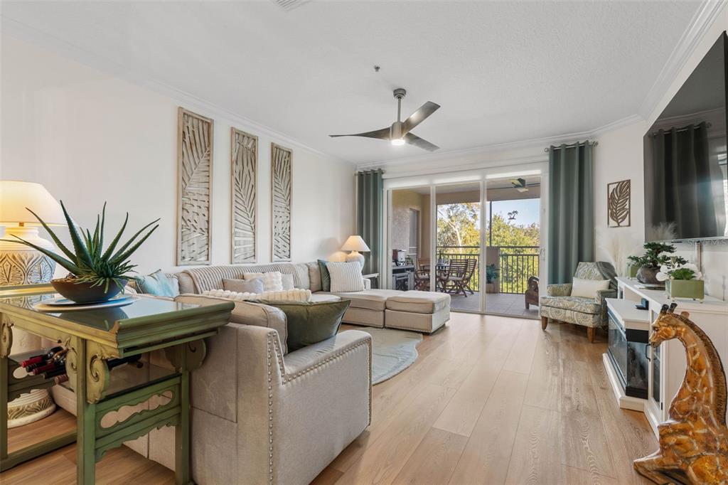 55 Riverview Bend South, Unit 2033 Palm Coast, FL 32137 - Photo 10 of 75 a living room with furniture fireplace and a large window