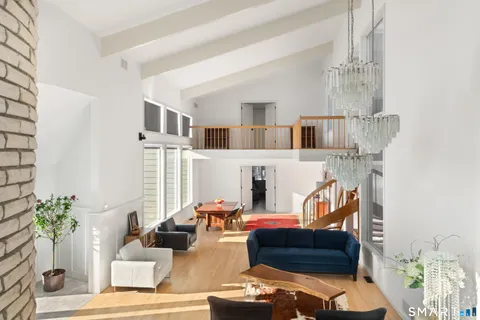 a dining room with a table chairs and entryway