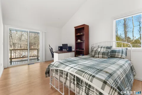 a picture of a room with a white wall and a painting
