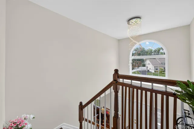 a view of staircase with rug