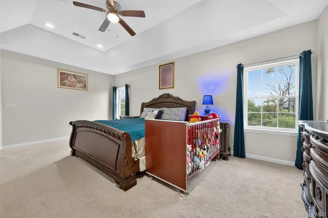 a bedroom with furniture and a window