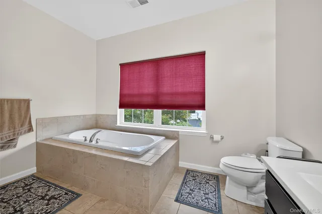 a bathroom with a bathtub and a sink