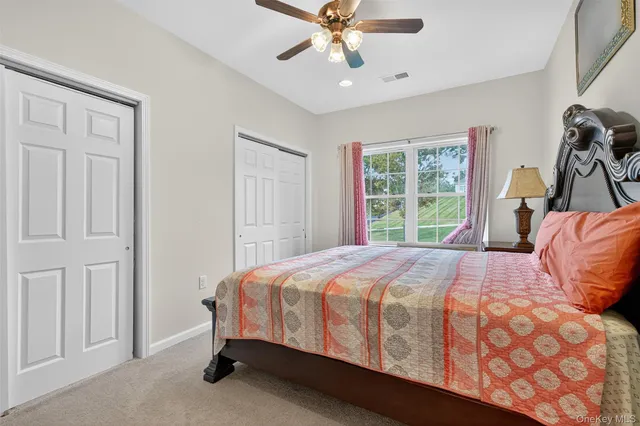 a bedroom with a bed and window