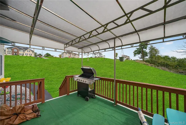 a view of a deck with a yard