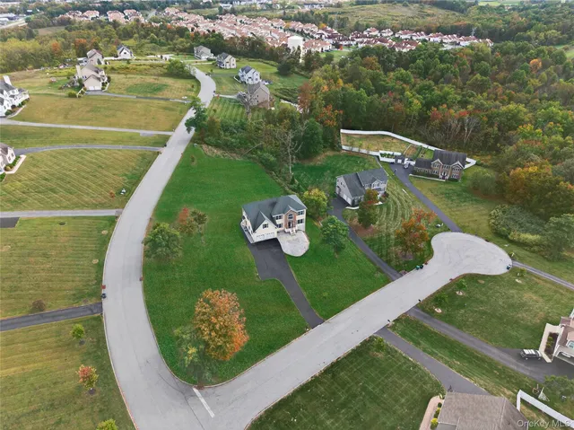 a view of a swimming pool with a yard