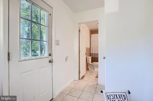 a bathroom with a sink toilet vanity and tub