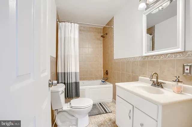 a bathroom with a sink a vanity and a mirror