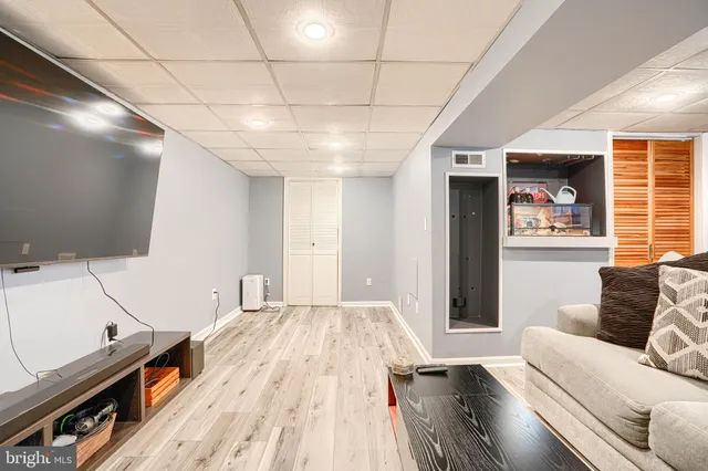 a bathroom with a sink a mirror and a shower