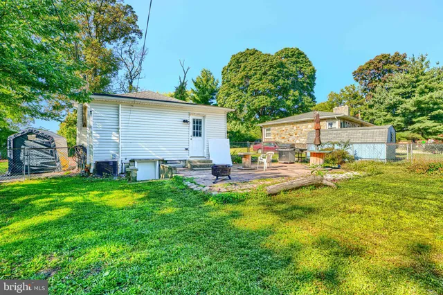 a front view of house with yard and seating area
