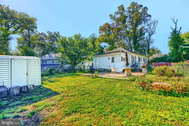 a house view with swimming pool in front of it
