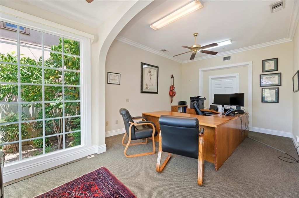 3845 Tenth Street Riverside, CA 92501 - Photo 12 of 45 a living room with furniture and a window