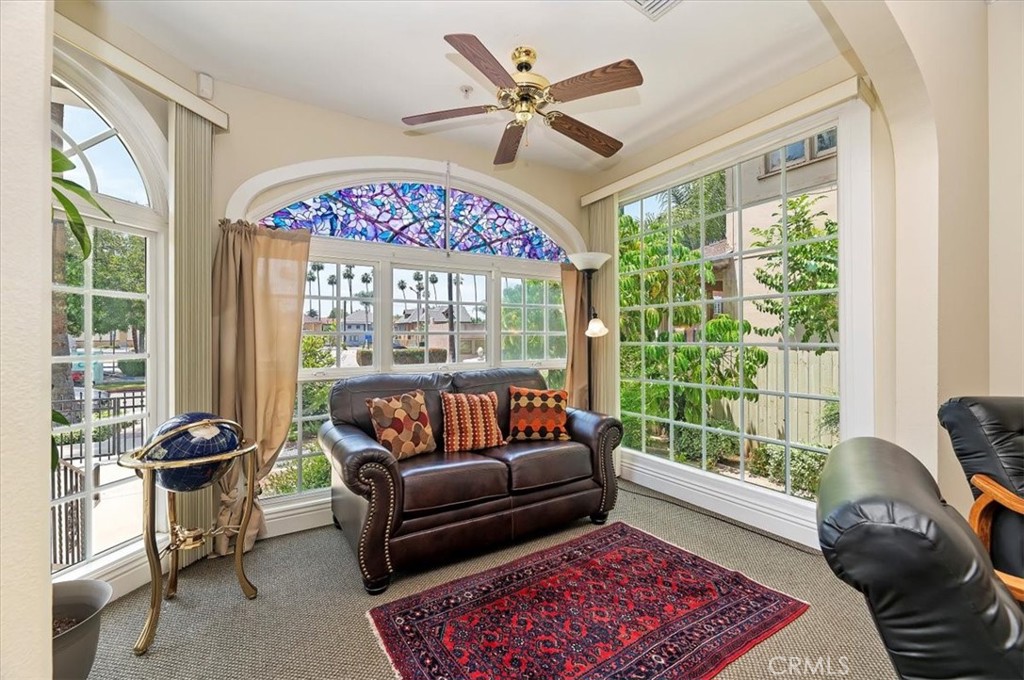 3845 Tenth Street Riverside, CA 92501 - Photo 14 of 45 a living room with furniture and a large window