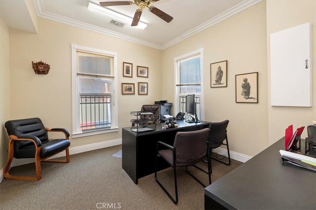 3845 Tenth Street Riverside, CA 92501 - Photo 17 of 45 a view of a workspace with furniture and a window