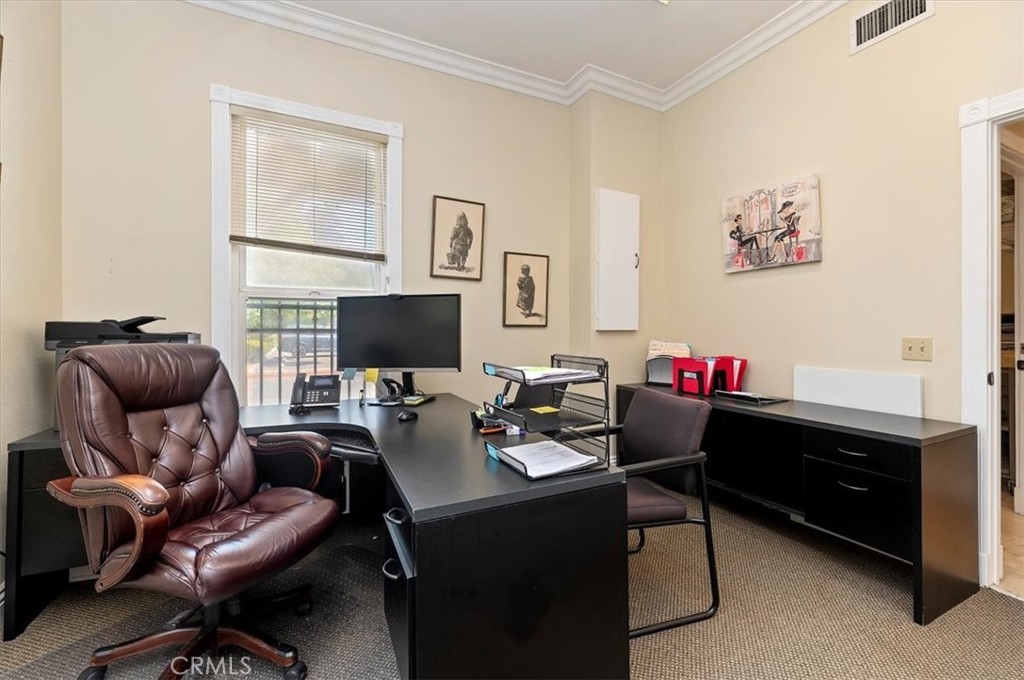 3845 Tenth Street Riverside, CA 92501 - Photo 18 of 45 a living room with furniture and a flat screen tv