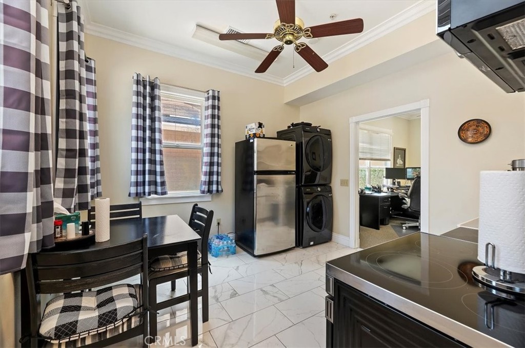 3845 Tenth Street Riverside, CA 92501 - Photo 21 of 45 a kitchen with a refrigerator and a sink