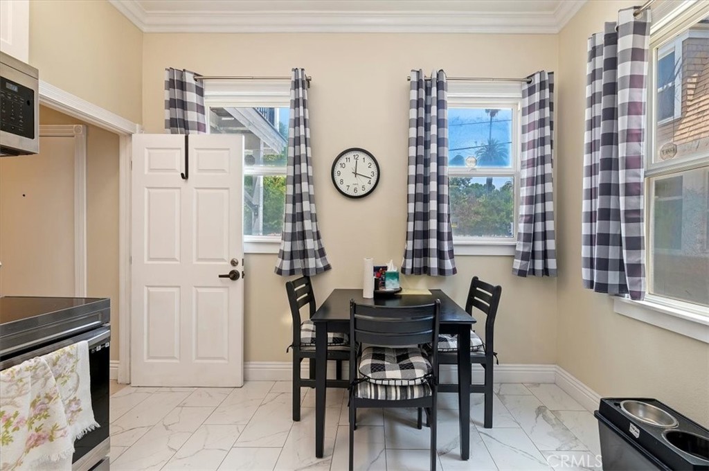 3845 Tenth Street Riverside, CA 92501 - Photo 25 of 45 a view of a dining room with furniture and a large window