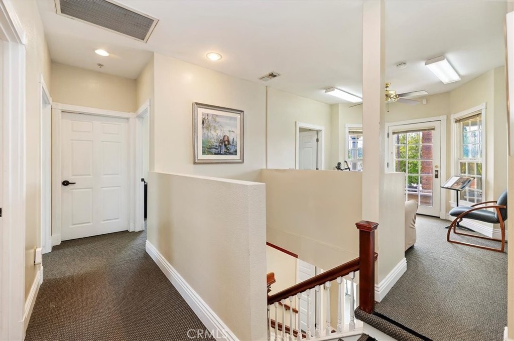 3845 Tenth Street Riverside, CA 92501 - Photo 26 of 45 a view of a hallway with workspace