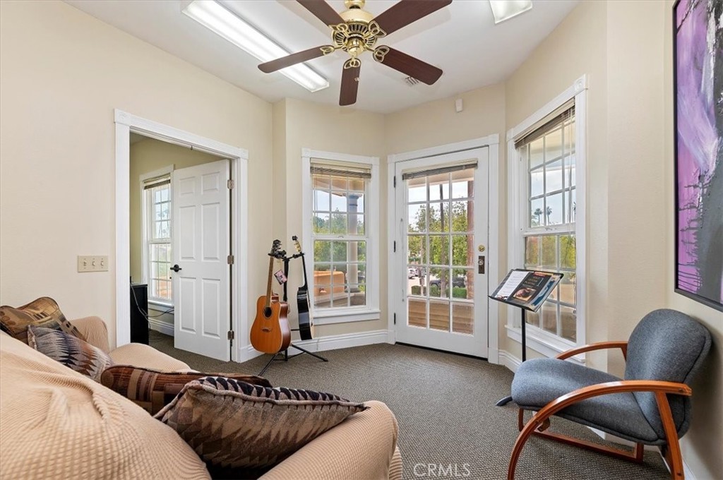 3845 Tenth Street Riverside, CA 92501 - Photo 27 of 45 a living room with furniture and two windows