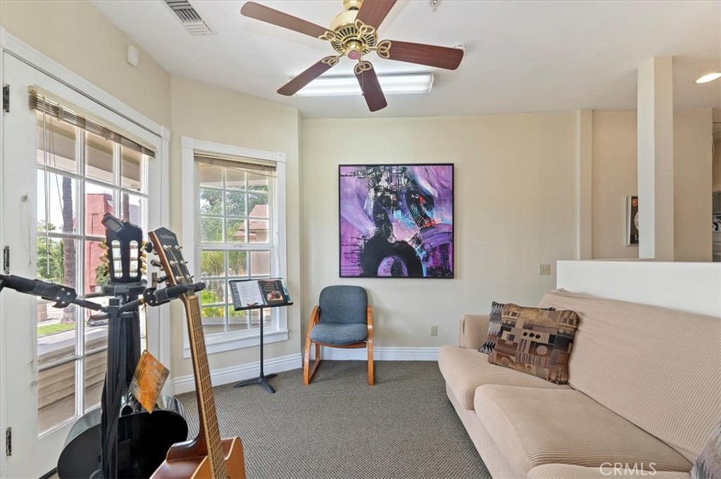 3845 Tenth Street Riverside, CA 92501 - Photo 29 of 45 a living room with furniture flowerpot and a window