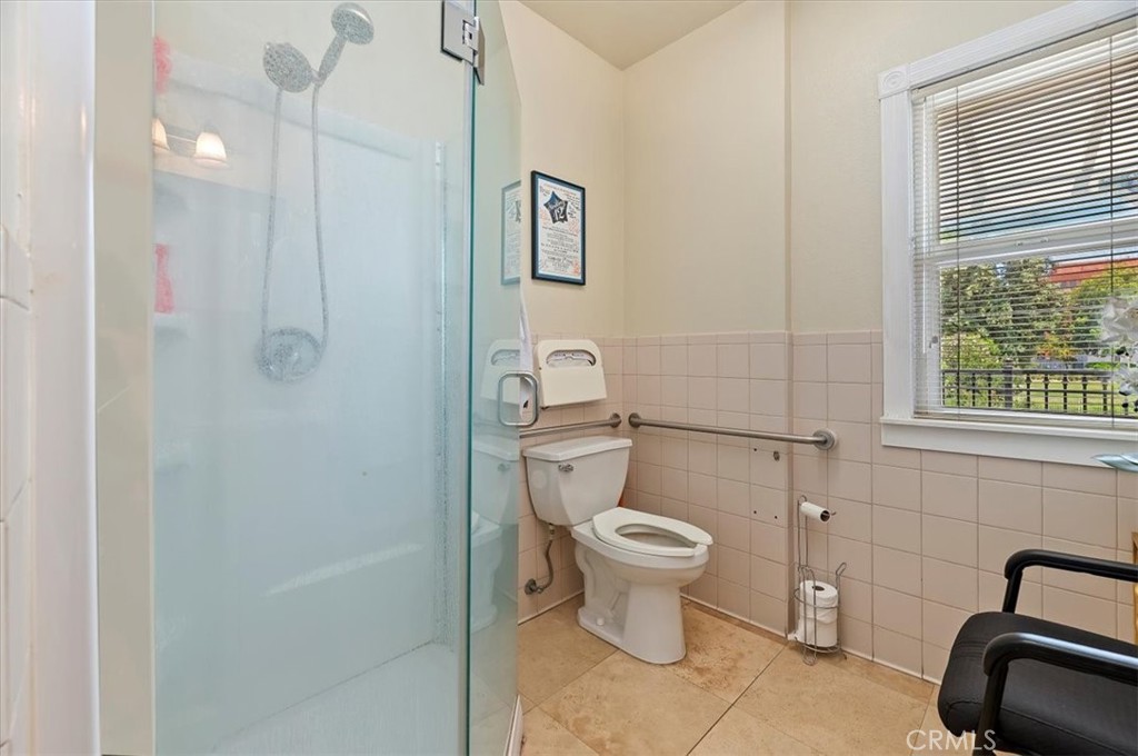 3845 Tenth Street Riverside, CA 92501 - Photo 33 of 45 a bathroom with a sink a toilet and shower
