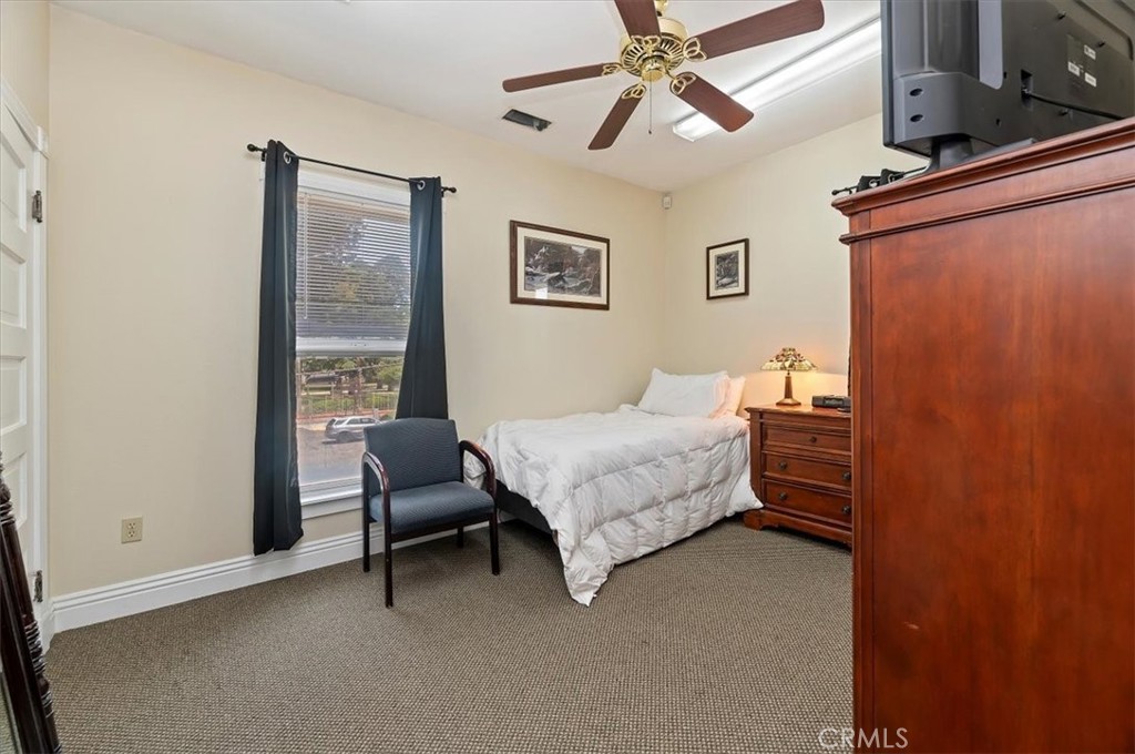3845 Tenth Street Riverside, CA 92501 - Photo 34 of 45 a bedroom with a bed and a window